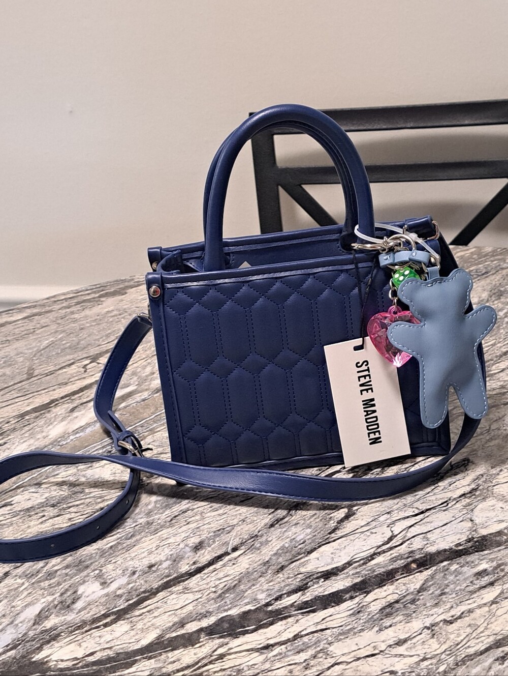Steve Madden Navy Binko Quilted Satchel with Bag Charms & Cross.\nBody Strap - Picture 4 of 6